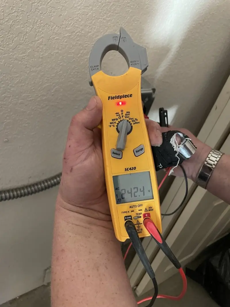 Voltage testing with clamp meter during Generator Installation in Blooming Grove